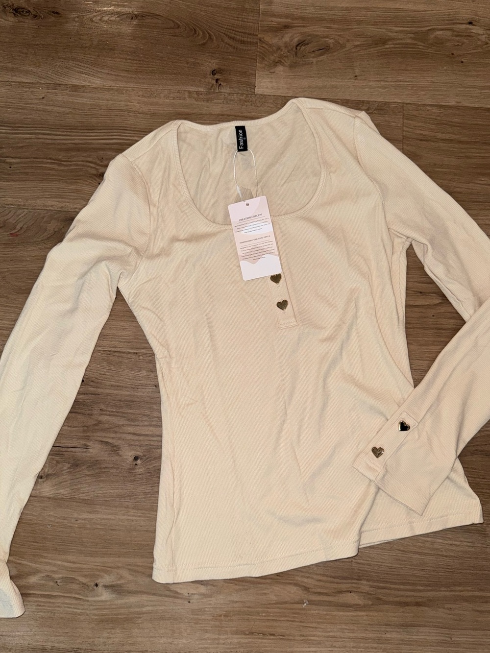 Brand new beige long sleeve top with gold heart buttons